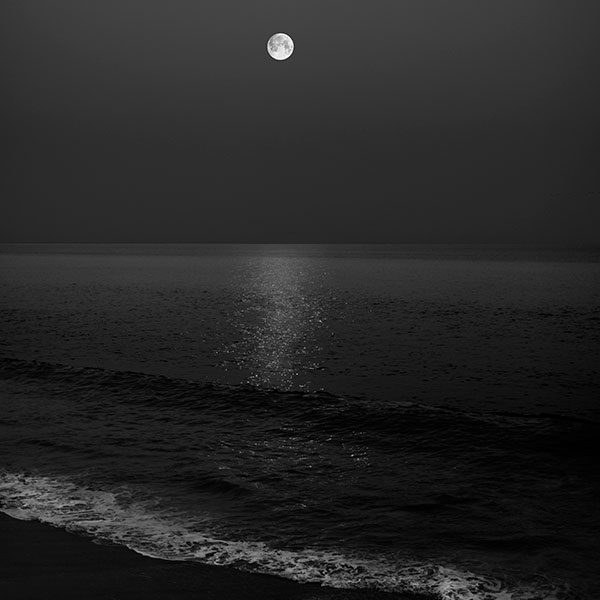 Sleep underneath the full moon, stars, and the ocean waves
