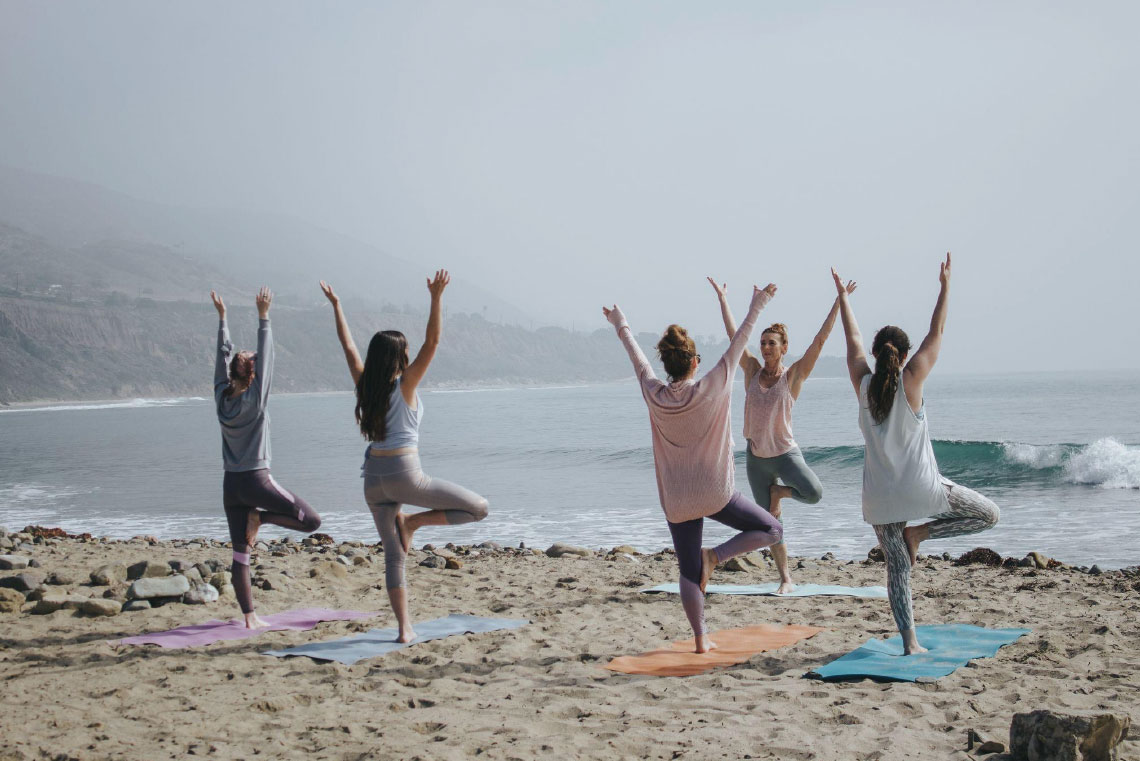 5 beach-friendly yoga poses that will leave you refreshed and